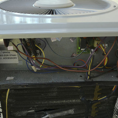 An Air Conditioner Opened for Repairs.