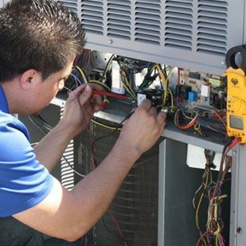 A Technician Maintains an Air Conditioner.