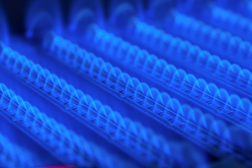 Propane flame inside of gas boiler furnace